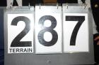 13057